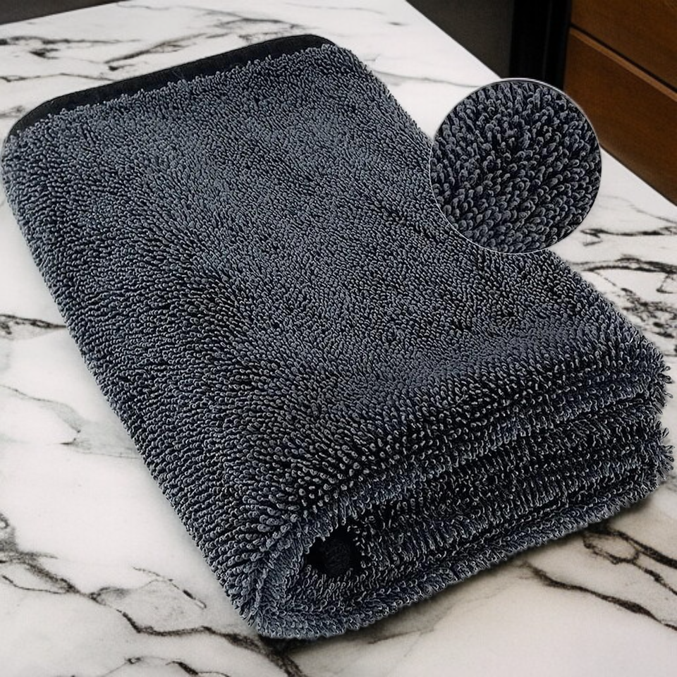 Double sided absorbent edge wrapped cleaning towel
