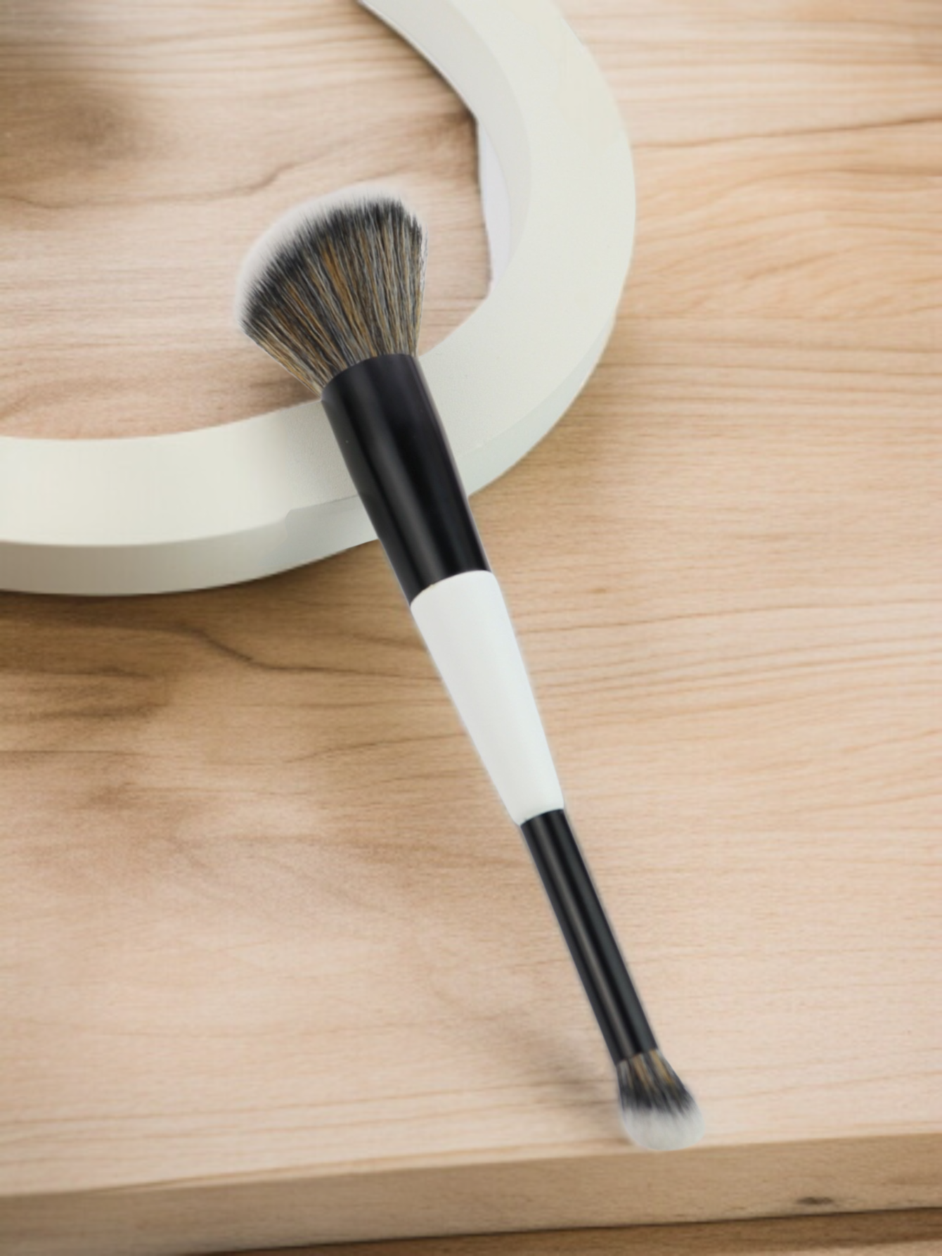 Professional dual head makeup brush in use