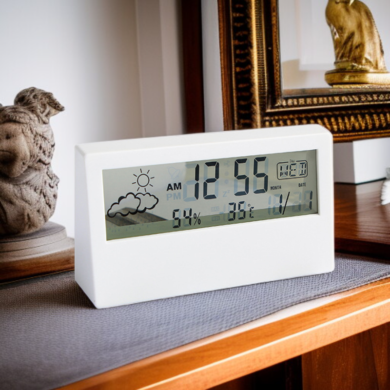 Portable digital alarm clock with humidity sensor