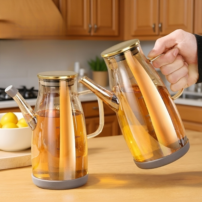 Botella de aceite de vidrio para la cocina del hogar.