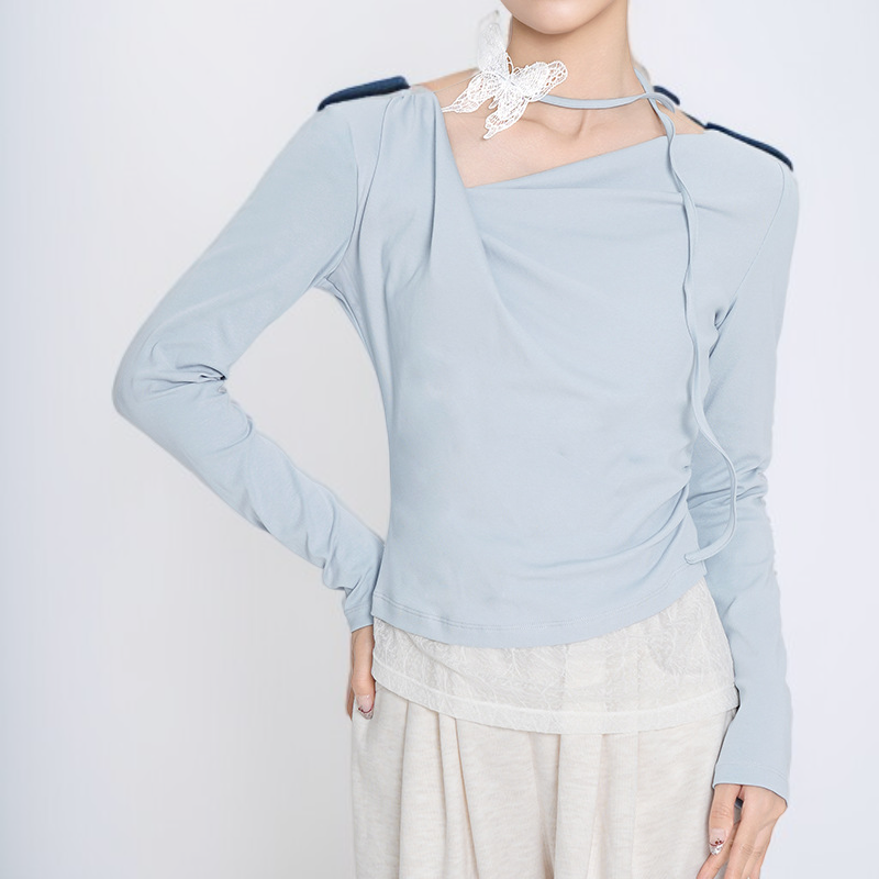 フェイクツーピース風の不規則な長袖トップス