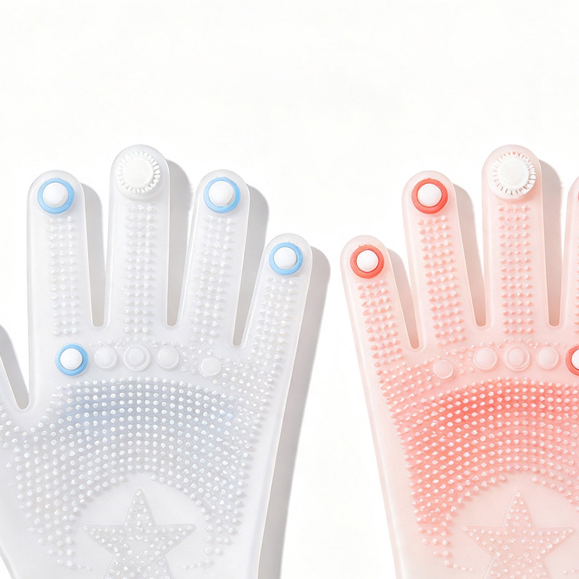 Close-up of textured silicone gloves scrubbing a plate