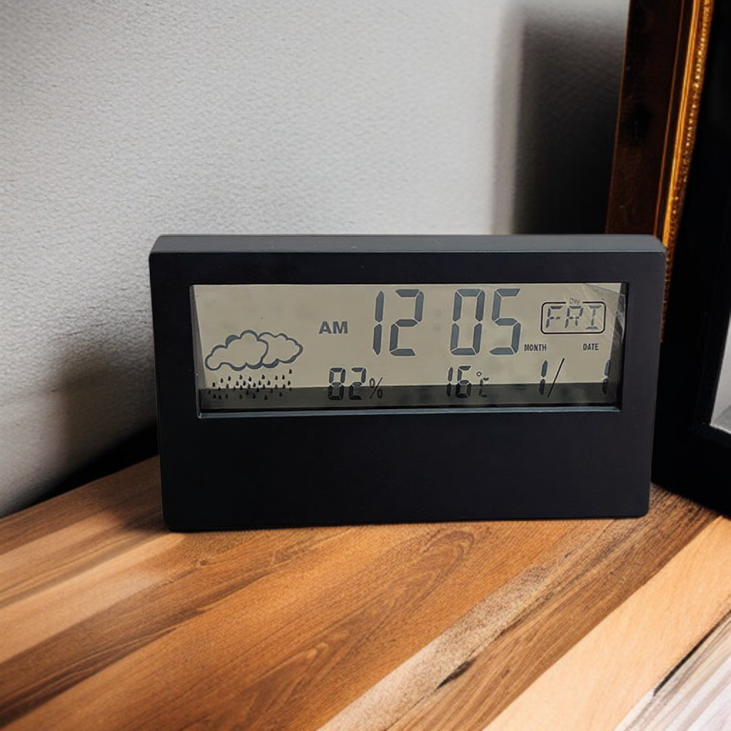 Temperature and humidity monitoring alarm clock