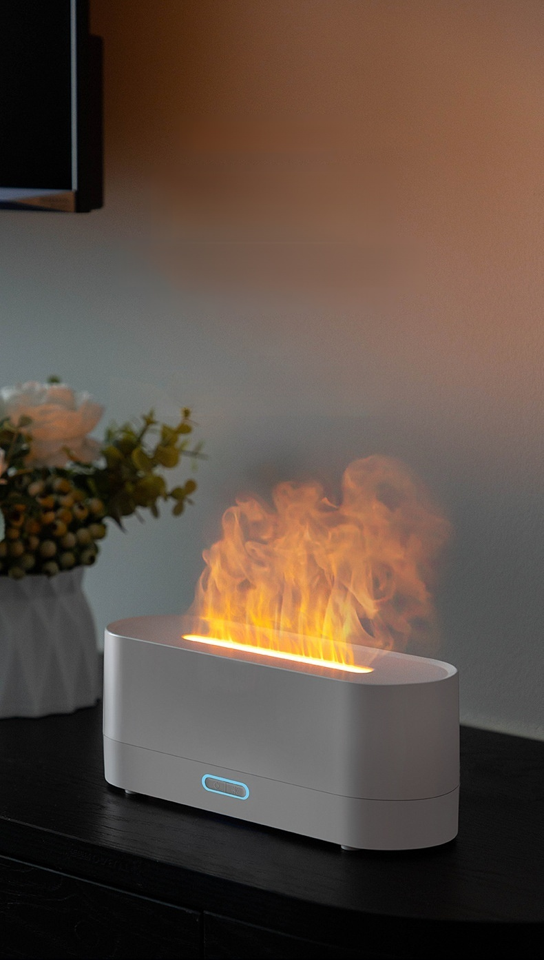 Small ultrasonic humidifier with flame effect on table