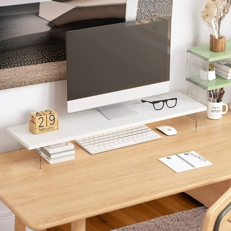 Support d'écran en acrylique transparent sur un bureau moderne