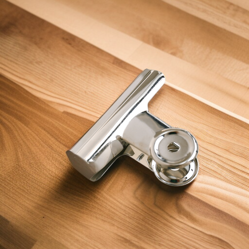 Binder clip used for organizing photos and crafts