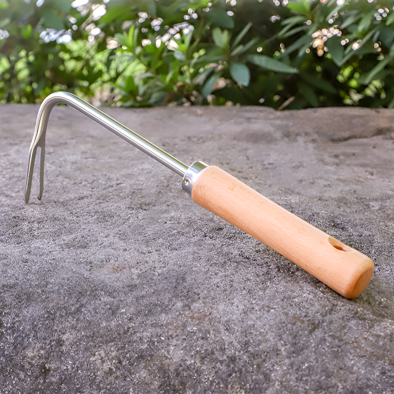 Wooden handle weeding machine