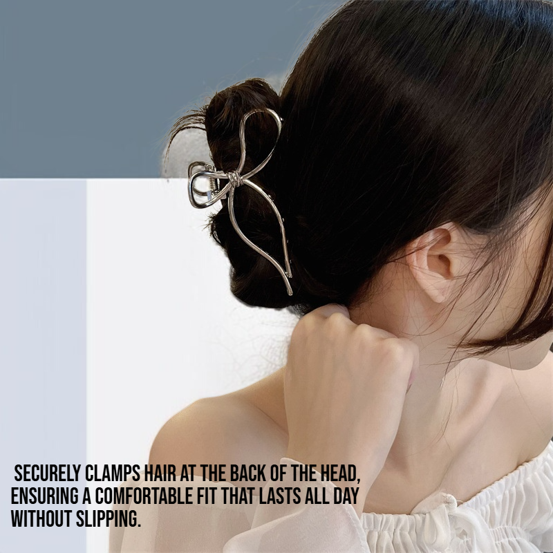 Hair at the back of the head is clamped with a bow metal clip