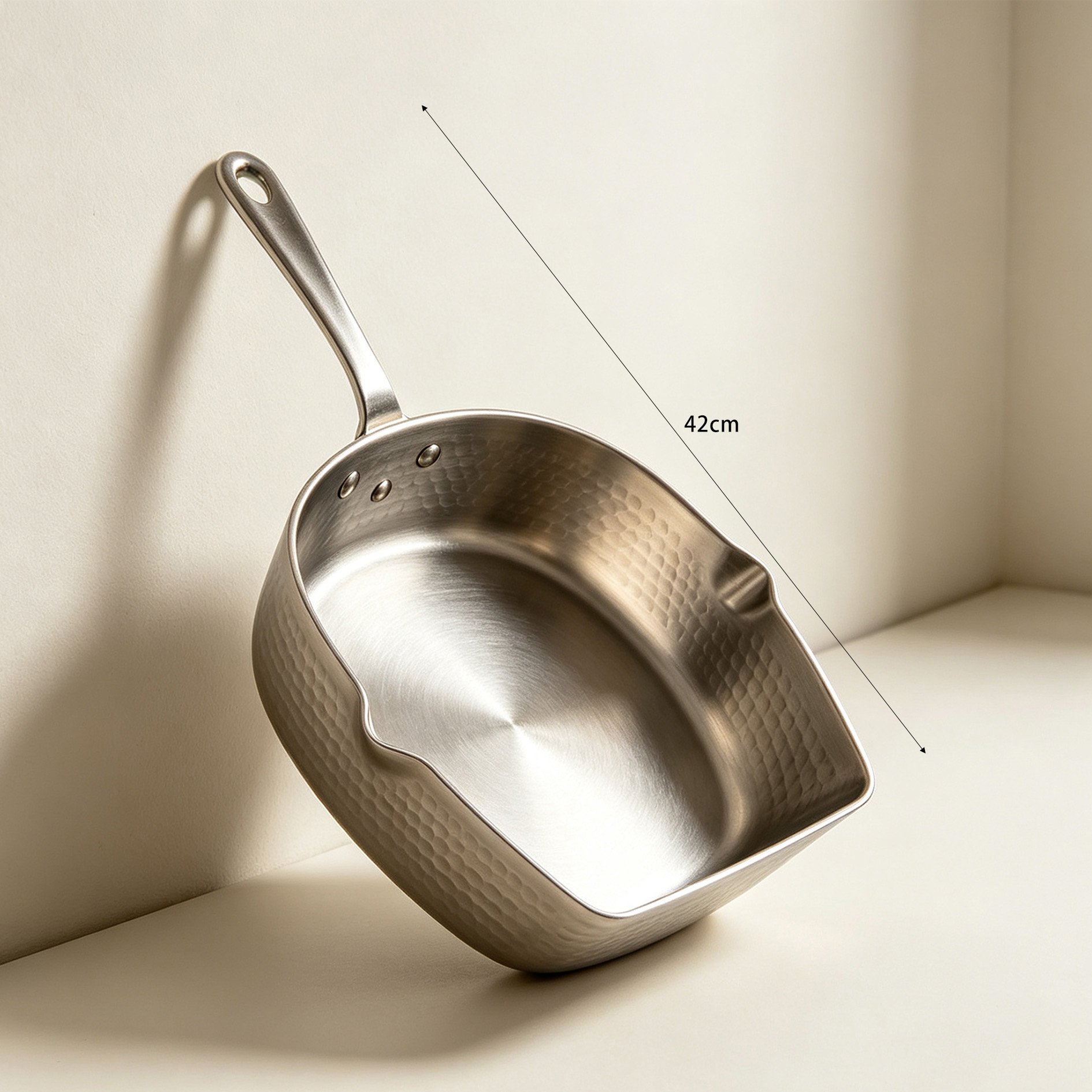 Side view of hammered stainless steel square pot