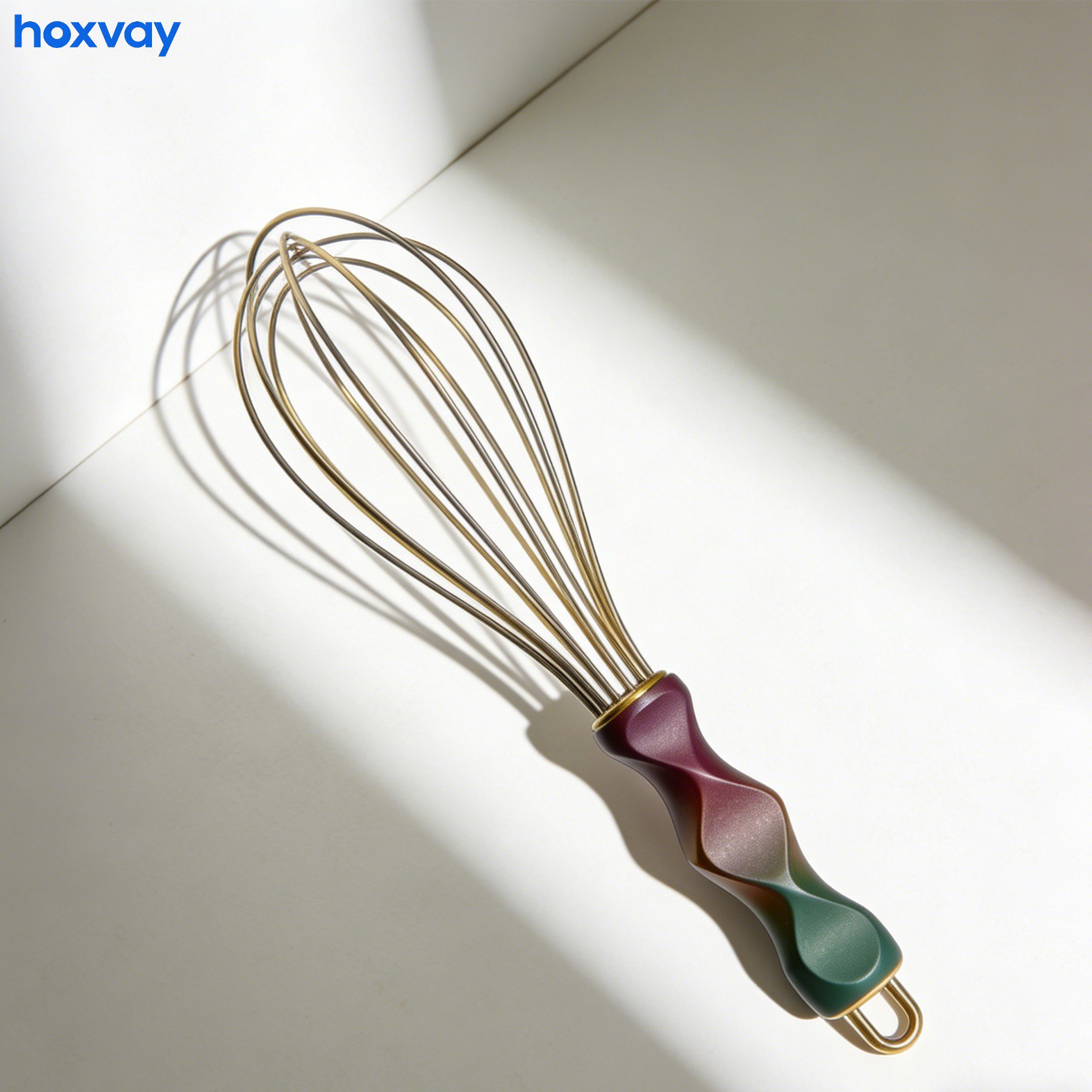 Close-up of stainless steel hand whisk ergonomic handle
