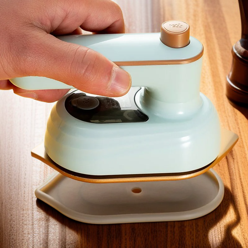 コンパクトで持ち運び可能な回転式電動アイロン