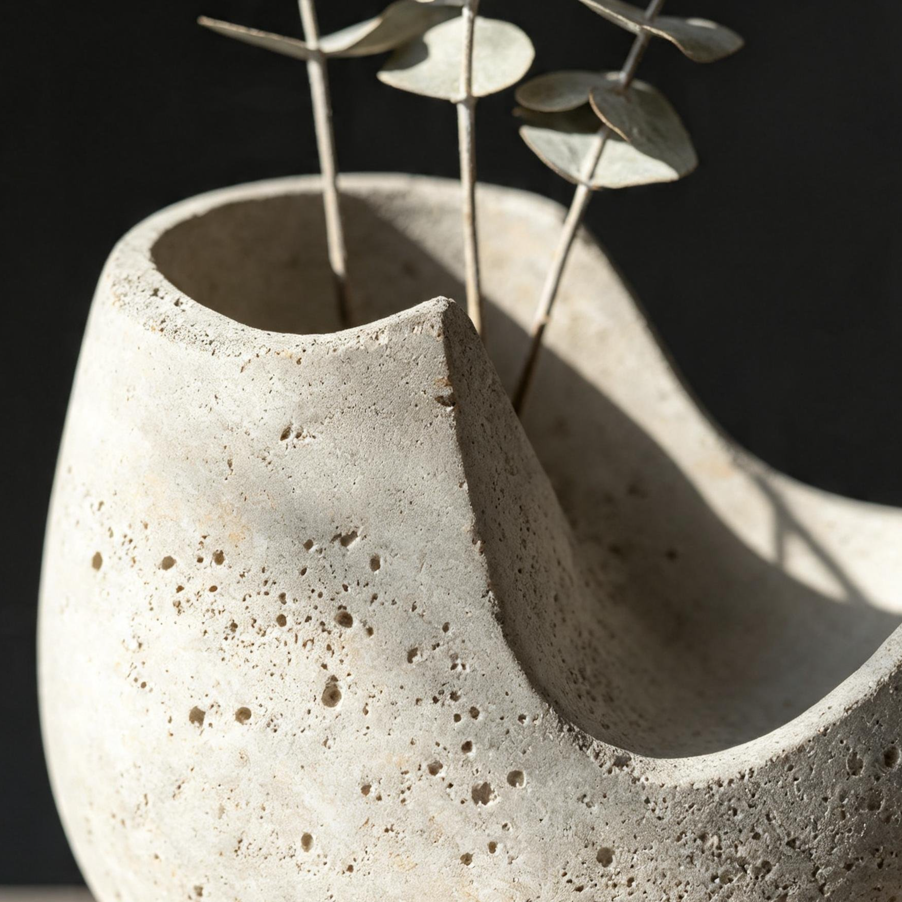 Minimalist monochrome ceramic vase with fresh flowers
