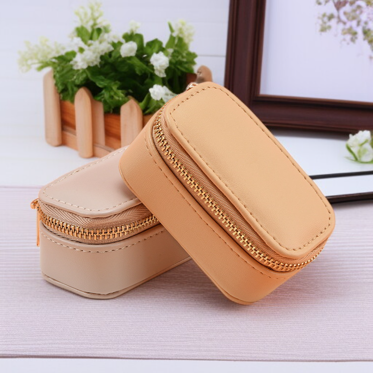 Travel Earring Ring Box compact design displayed on a suitcase