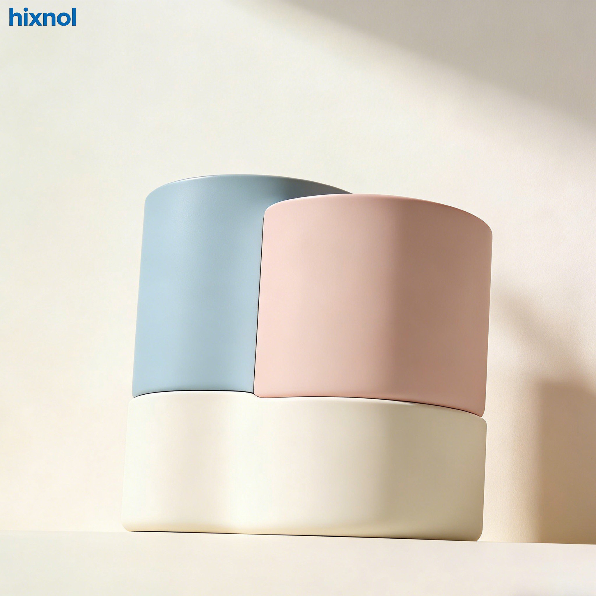 Black pen holder filled with colorful pens and pencils