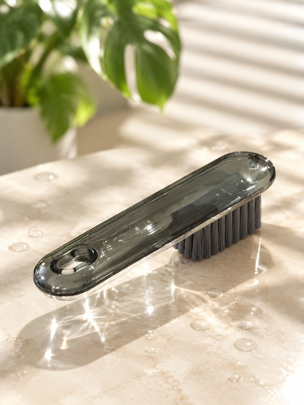 Household cleaning brush for removing dirt from shoes