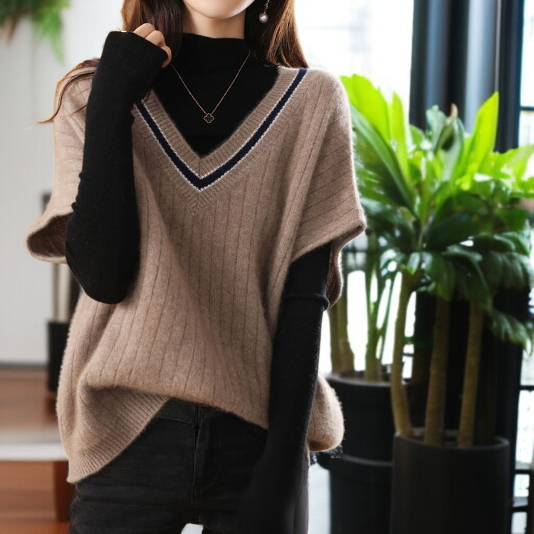 ニットの底の外にゆるいセーターの馬甲女性vネックの肩のセーターの外にゆるい馬甲がついている
