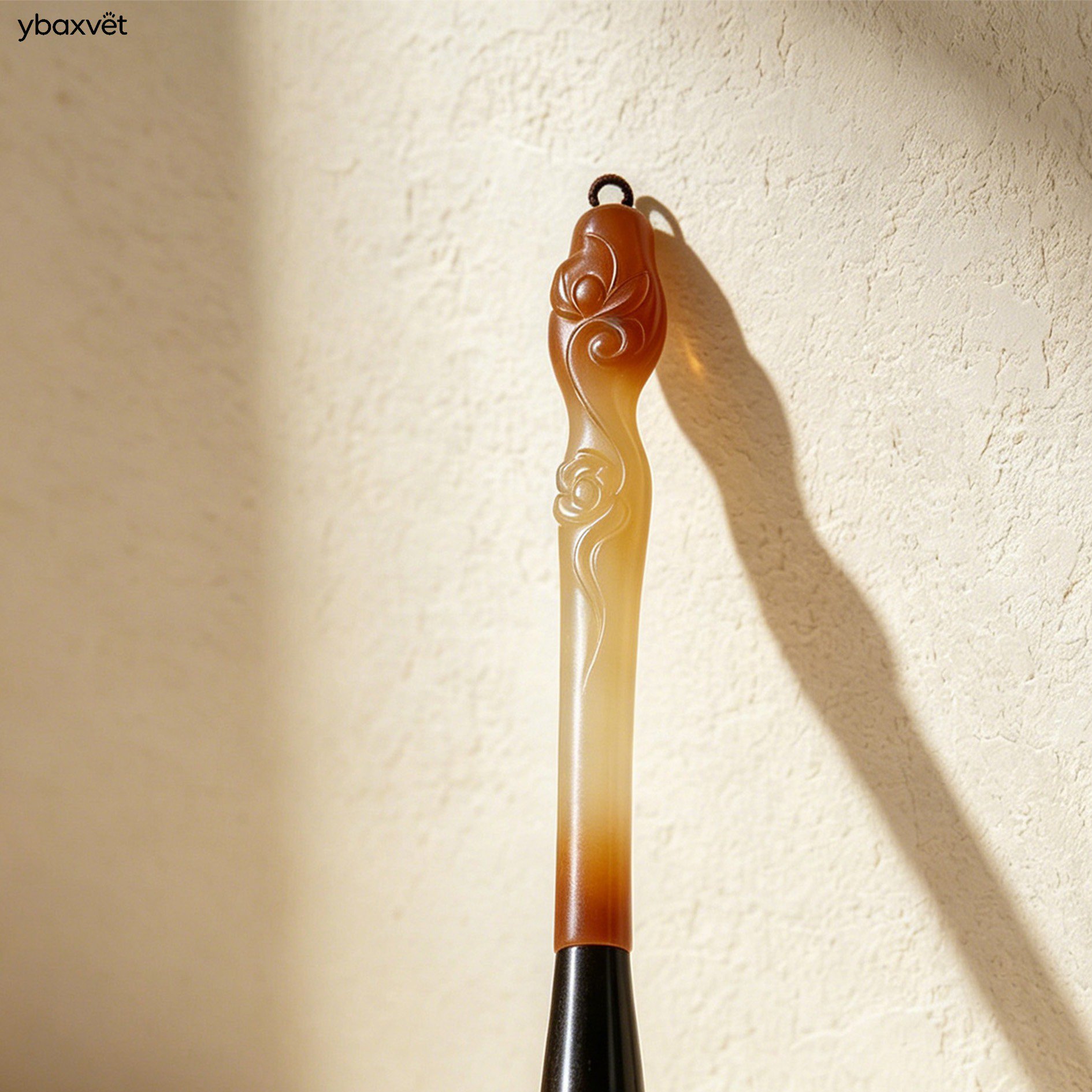 Close-up of hand-carved wooden handles on calligraphy brushes