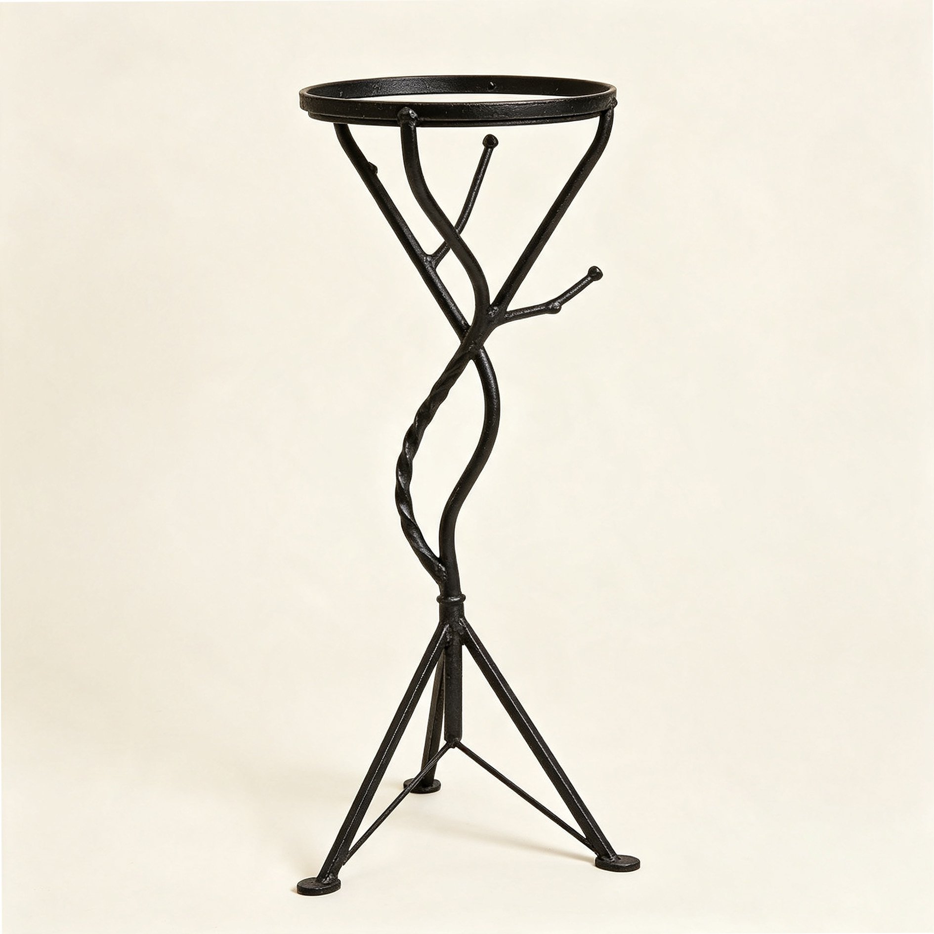 Decorative wrought iron flower stand with multiple tiers