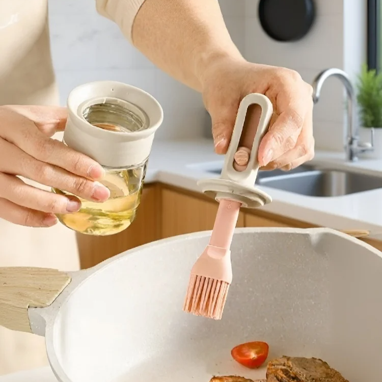 Oil brush spreading oil on a hot pan