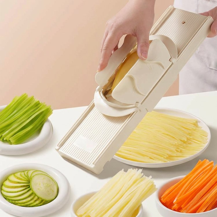 Essential kitchen tool: hand-safe vegetable slicer and shredder.