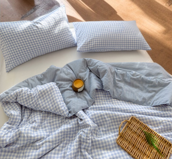 Summer bedding with lightweight plaid quilt