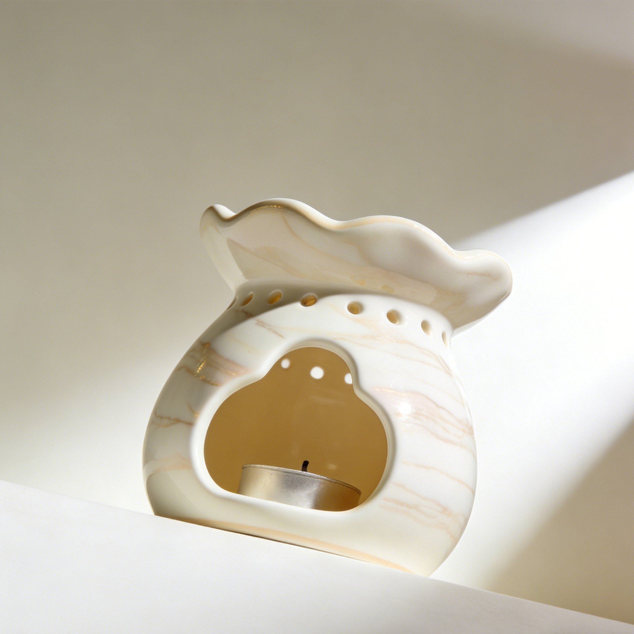 Ceramic aromatherapy burner with essential oil and candle