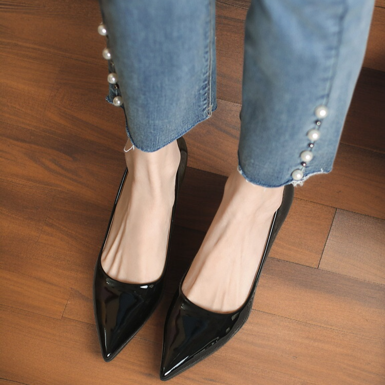 Close-up of pointed toe on stiletto heel