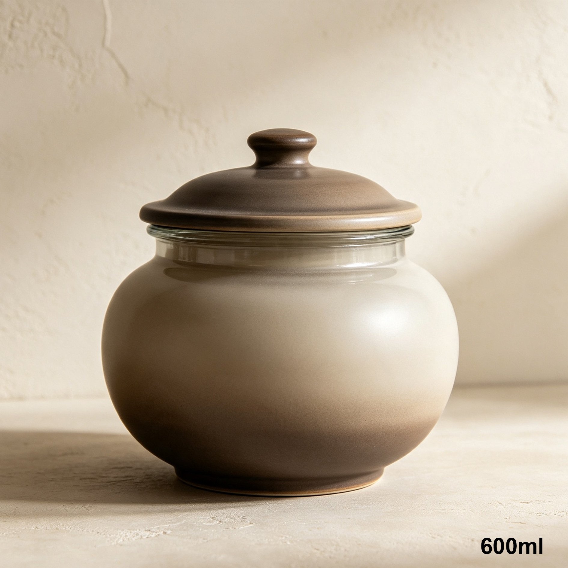 Set of four gradient ceramic airtight storage jars on kitchen counter