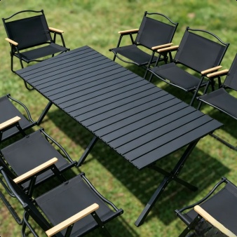 Camping table with matching chairs at a scenic campsite