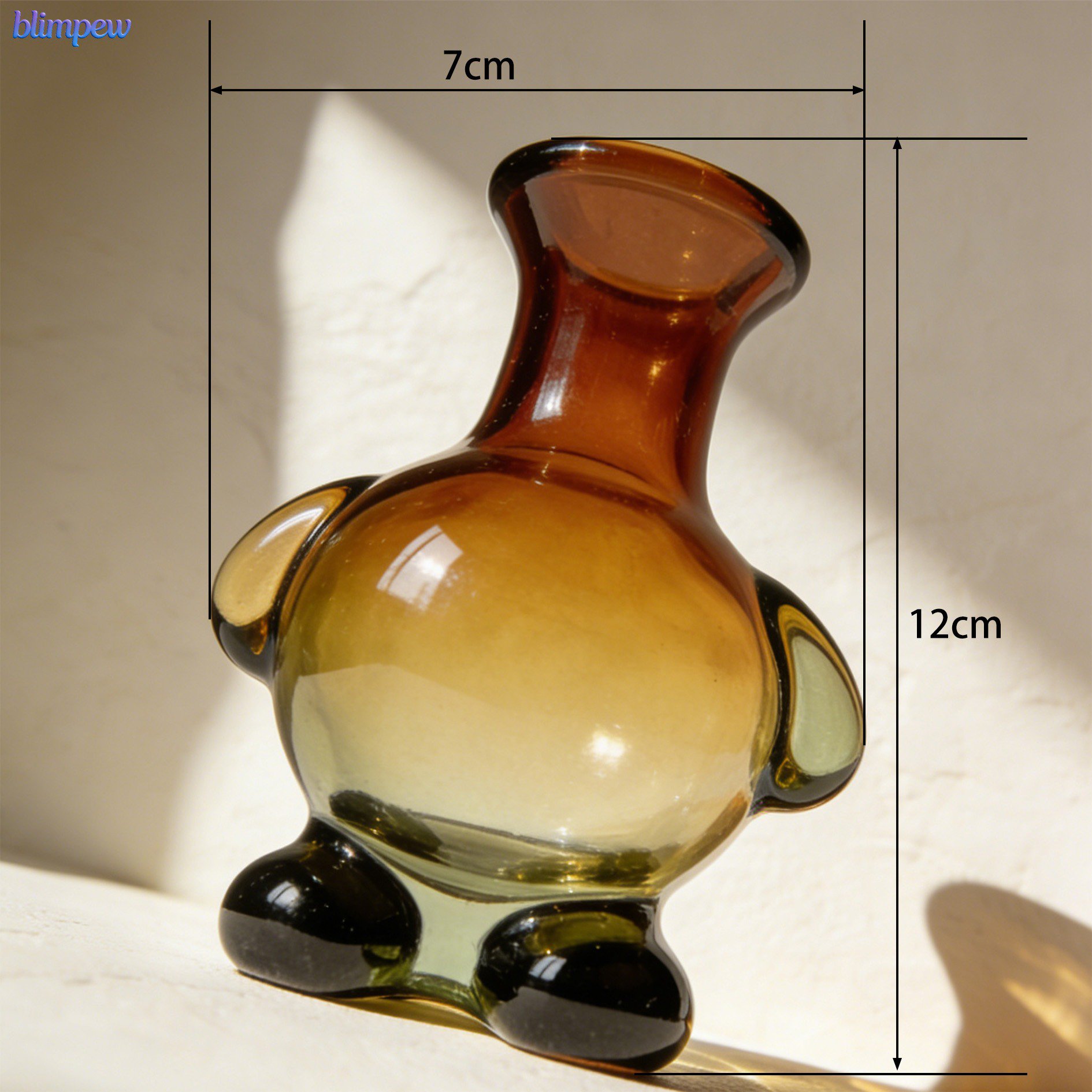 Transparent glass vases in assorted irregular forms