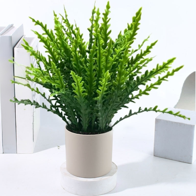 Adornos artificiales de plantas verdes