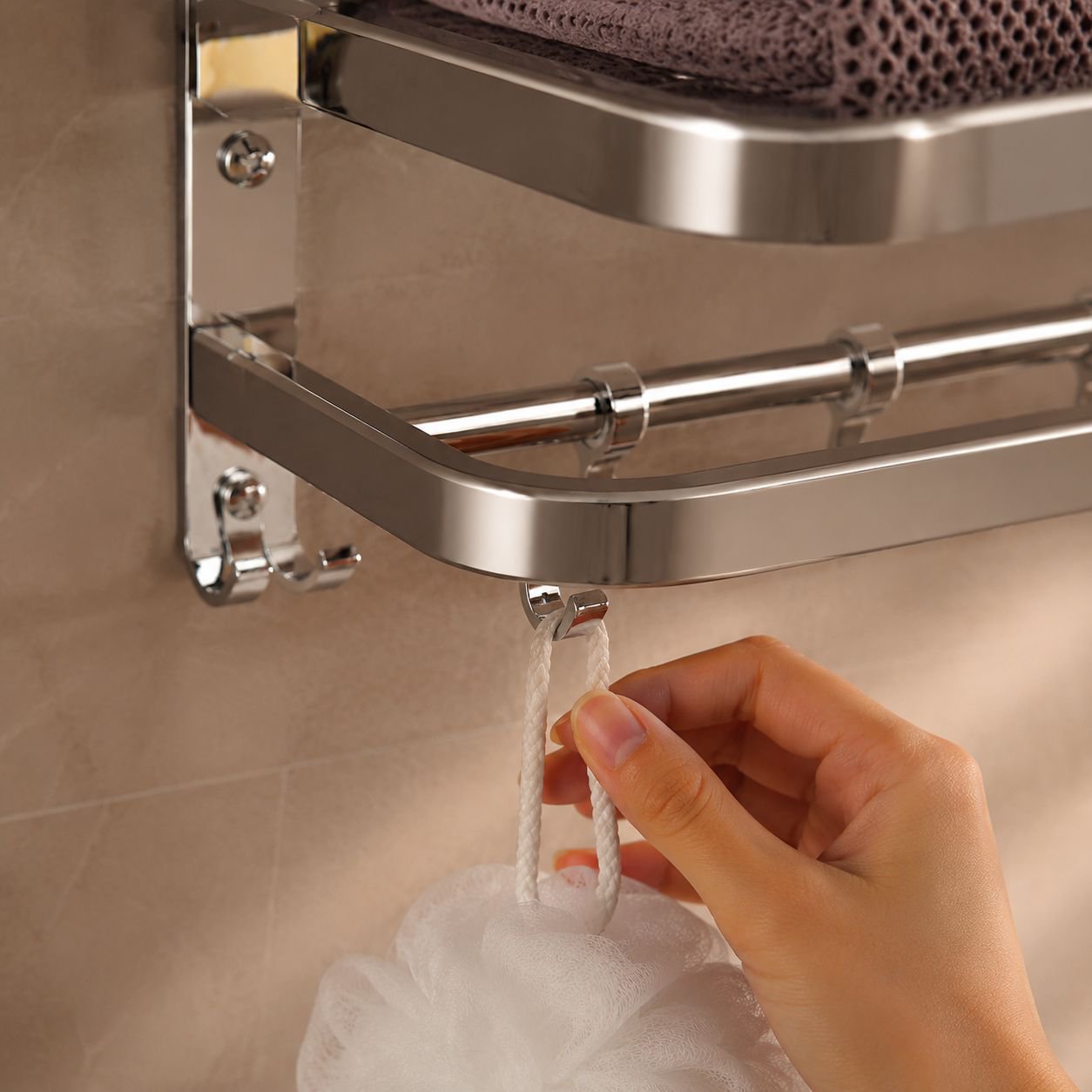 Durable bathroom shelf holding folded towels