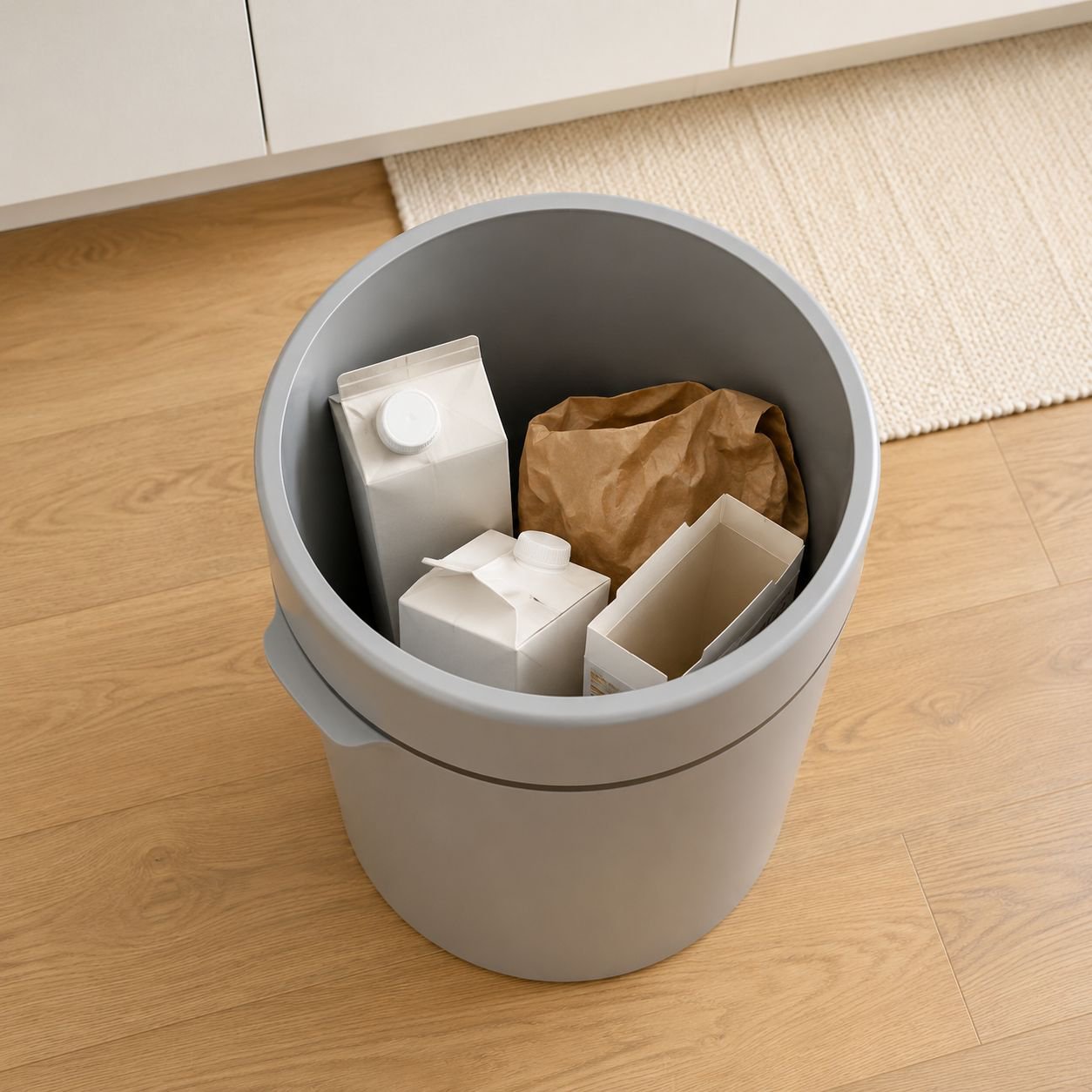 Hands-free pop-up lid trash can in use
