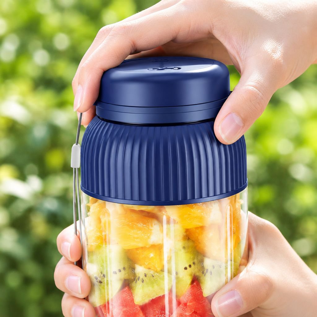 Small wireless portable electric juicer cup blending fresh fruits