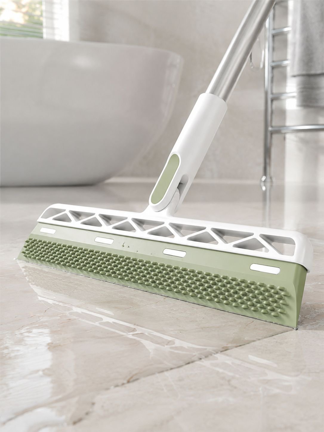 Multi-purpose magic broom cleaning a hard floor