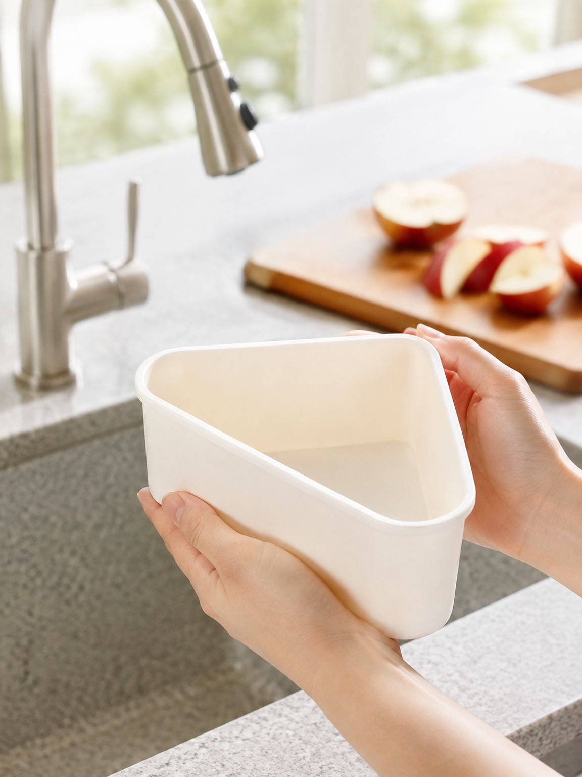Kitchen sink basket collecting food scraps and debris