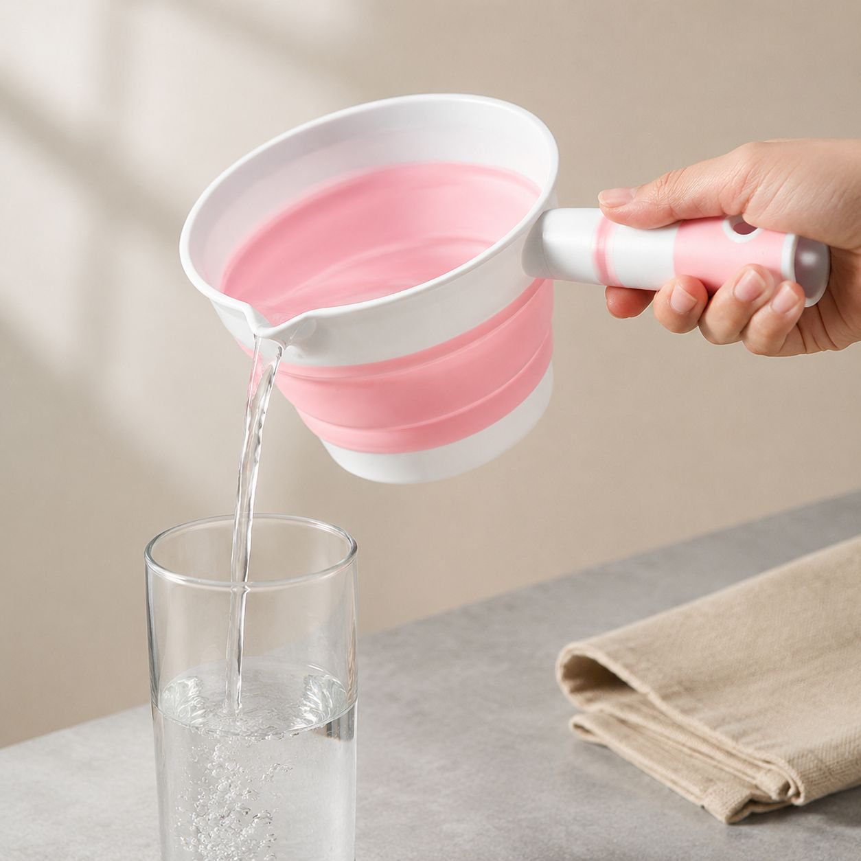 Space-saving foldable ladle in kitchen drawer