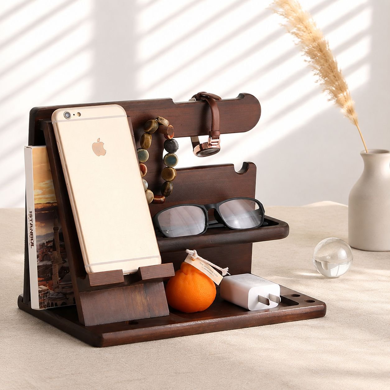 Phone, keys, and watch neatly arranged in desktop organizer