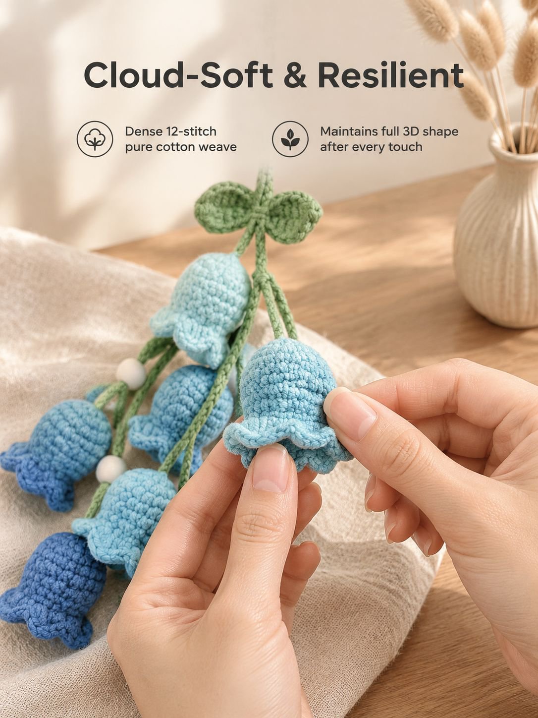 Crochet lily of the valley charm displayed as a car accessory