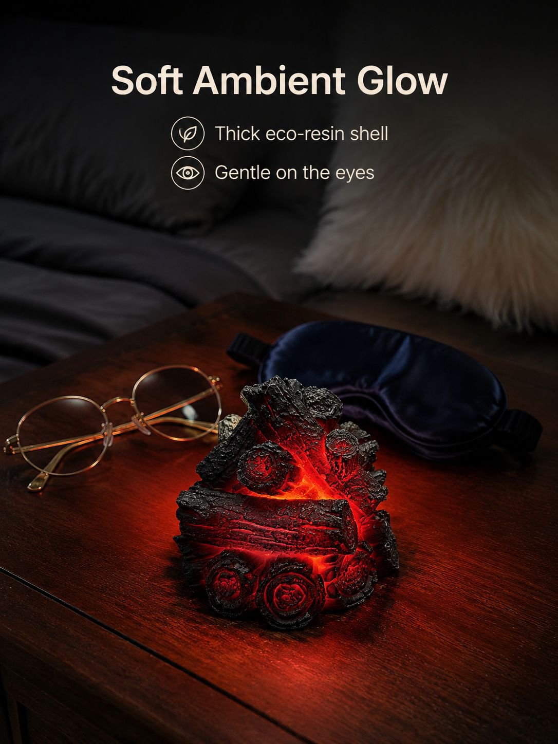 Soft flame effect glowing between faux charcoal pieces
