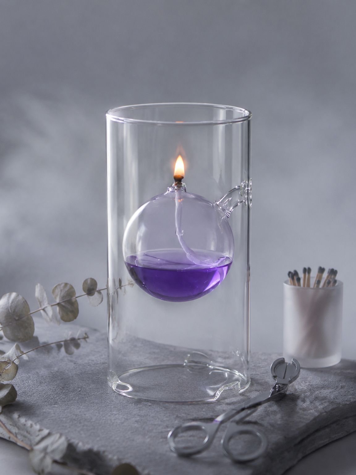 Elegant glass oil lamp with soft warm light for wedding decor