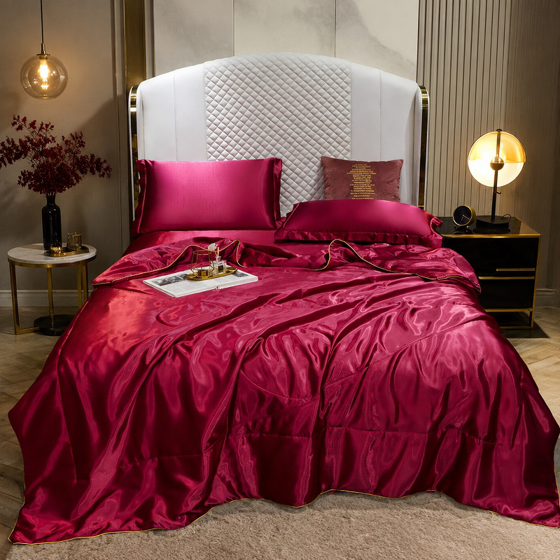 Luxury silk quilt cover on a modern bed