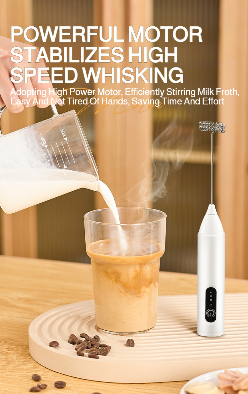 Electric frother whisking milk in a glass cup