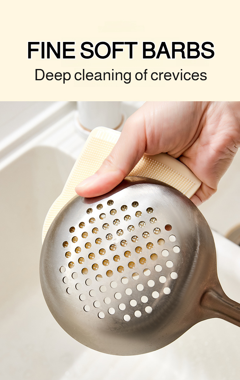 Silicone brush removing dirt from vegetables