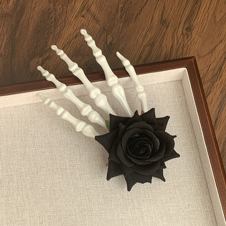 Horquilla de calavera con hueso de mano