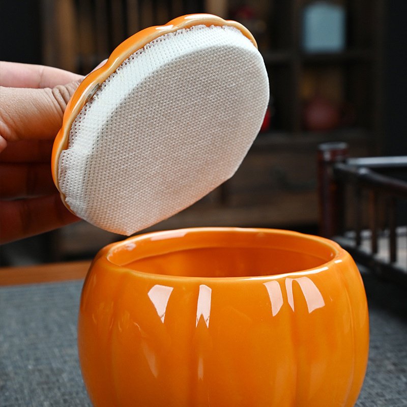 Decorative ceramic pumpkin canister for tea and snack storage