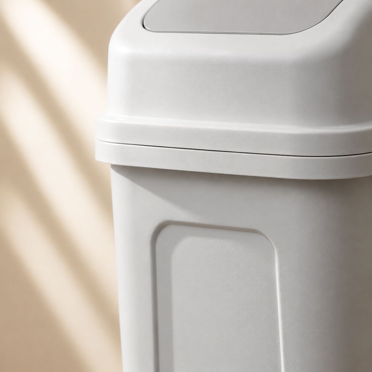 Compact waste bin with handle fits under office desk